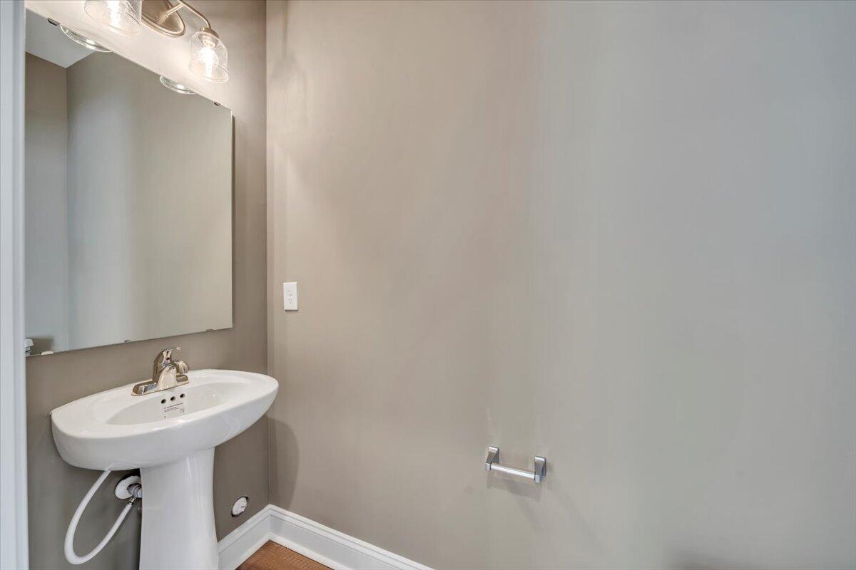 5615 Huntridge Road Roanoke, VA 24019 - Photo 9 of 21 a bathroom with a sink a mirror and a shower