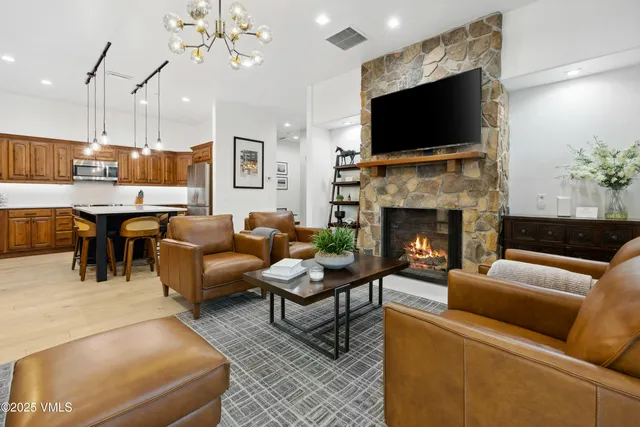 a view of a livingroom with workspace and a window