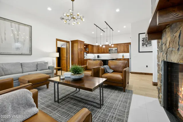 a bed room with a bed and a chandelier