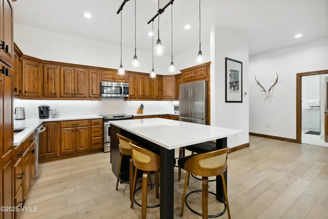 a bathroom with a tub a sink and a shower