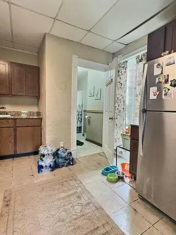 a kitchen with a stove and a refrigerator