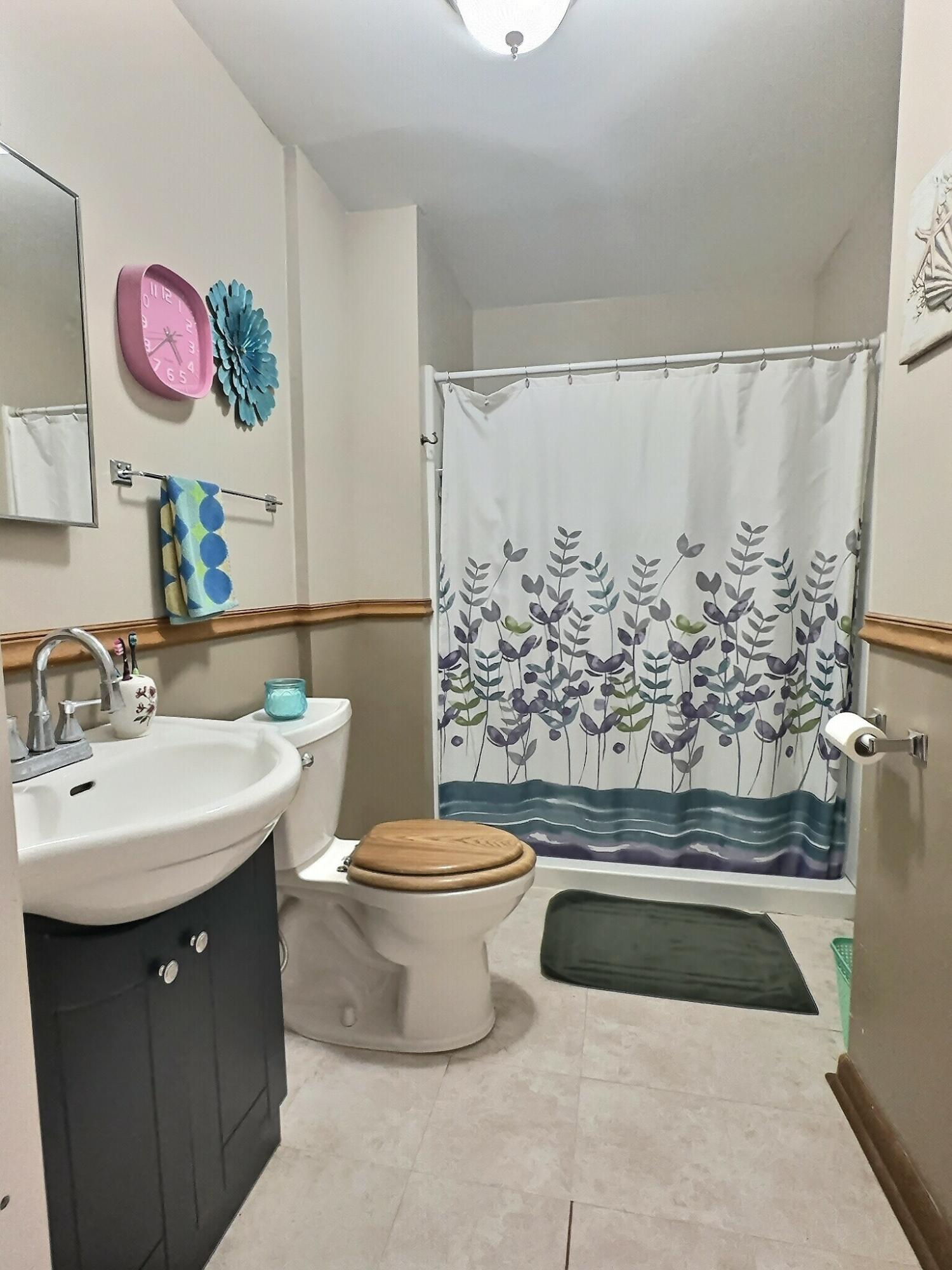 310 West State Street Morocco, IN 47963 - Photo 15 of 17 a bathroom with a toilet a sink and a shower