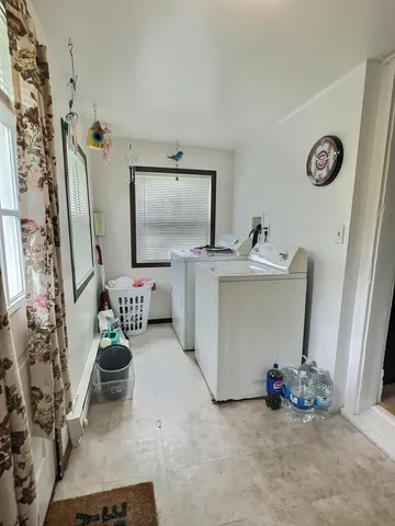 a view of hallway with washer and dryer