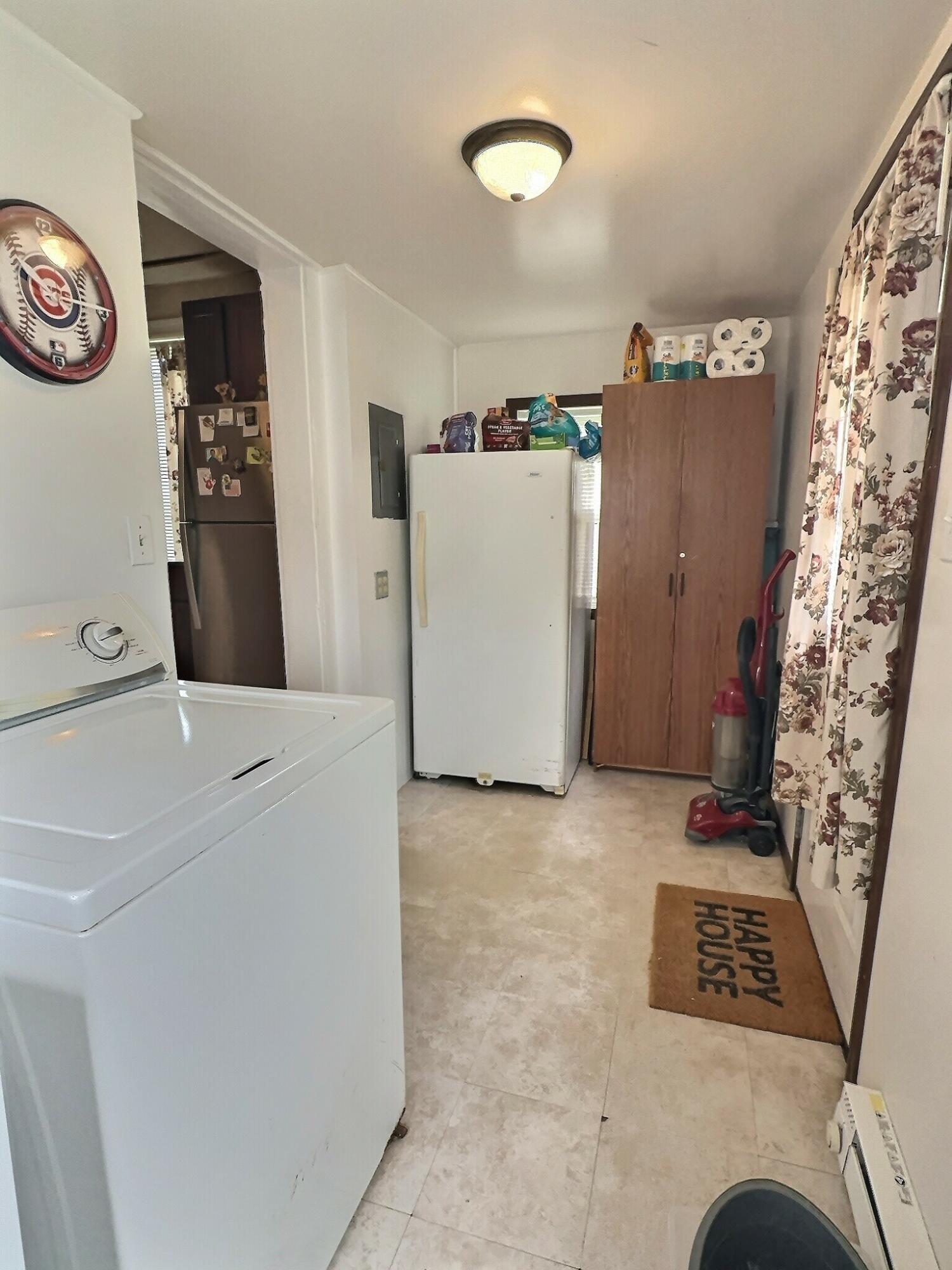 310 West State Street Morocco, IN 47963 - Photo 17 of 17 a view of hallway with washer and dryer