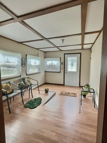 a view of a livingroom with furniture and dining table