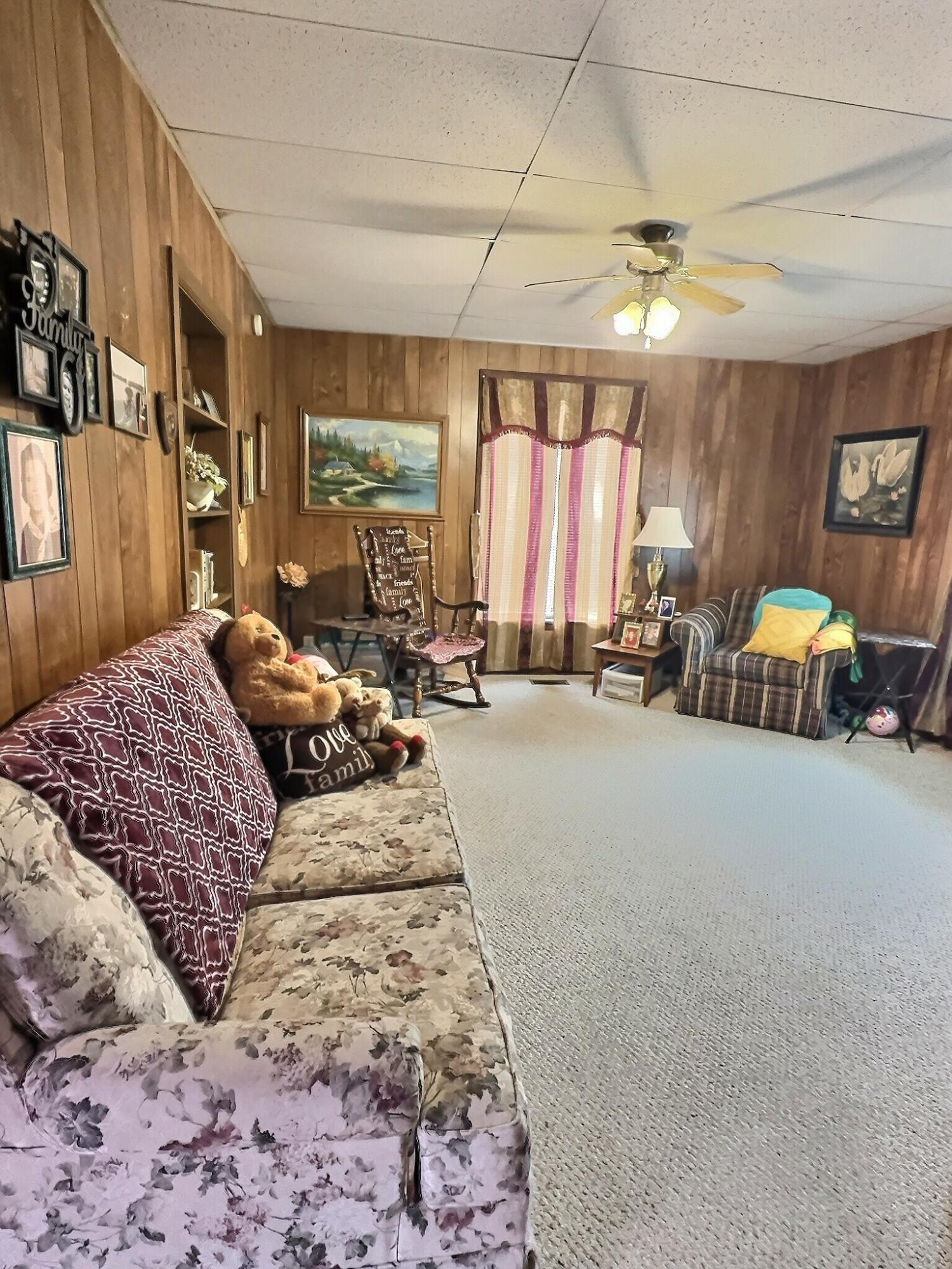 310 West State Street Morocco, IN 47963 - Photo 7 of 17 a bedroom with furniture and a large window