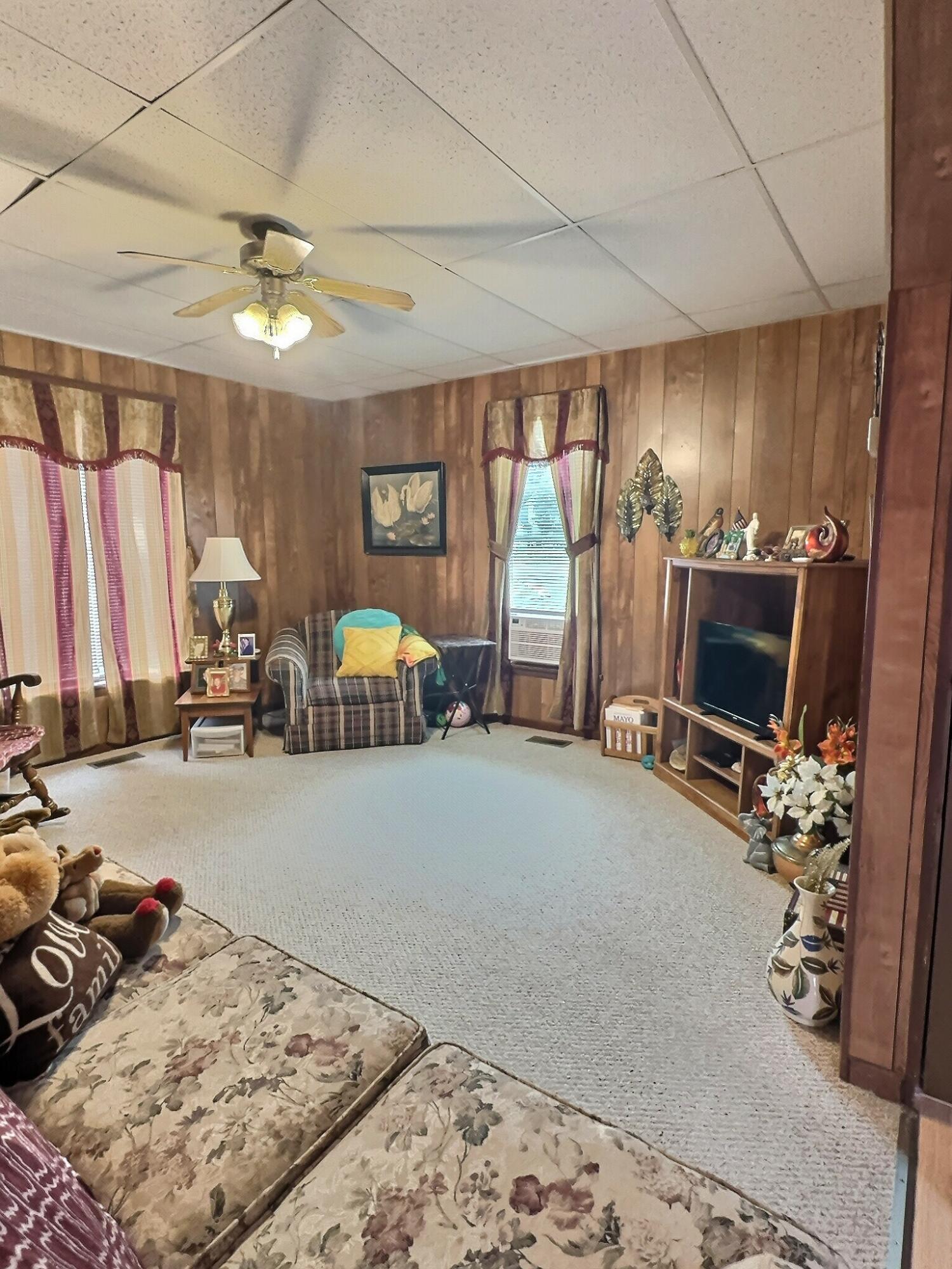 310 West State Street Morocco, IN 47963 - Photo 8 of 17 a bedroom with furniture and a flat screen tv