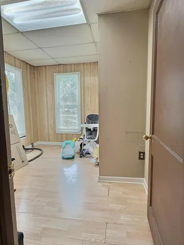 a view of a room that has a couch and a table in it