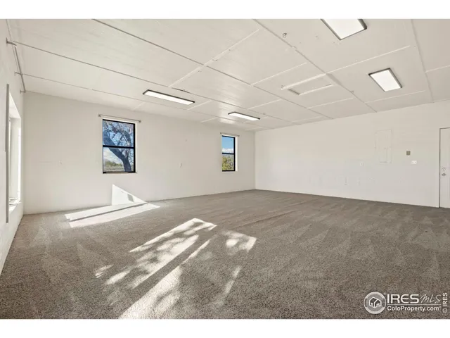 a view of a big room with wooden floor
