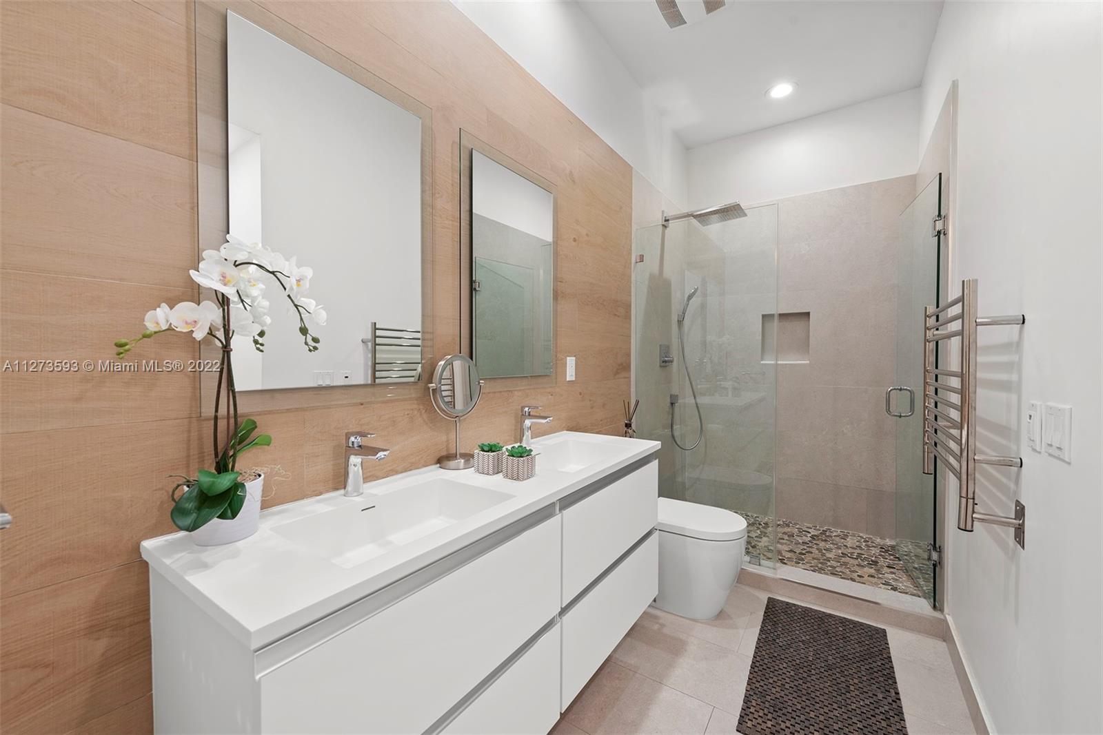 11411 Smathers Circle Pinecrest, FL 33156 - Photo 16 of 44 a bathroom with a sink a toilet and shower