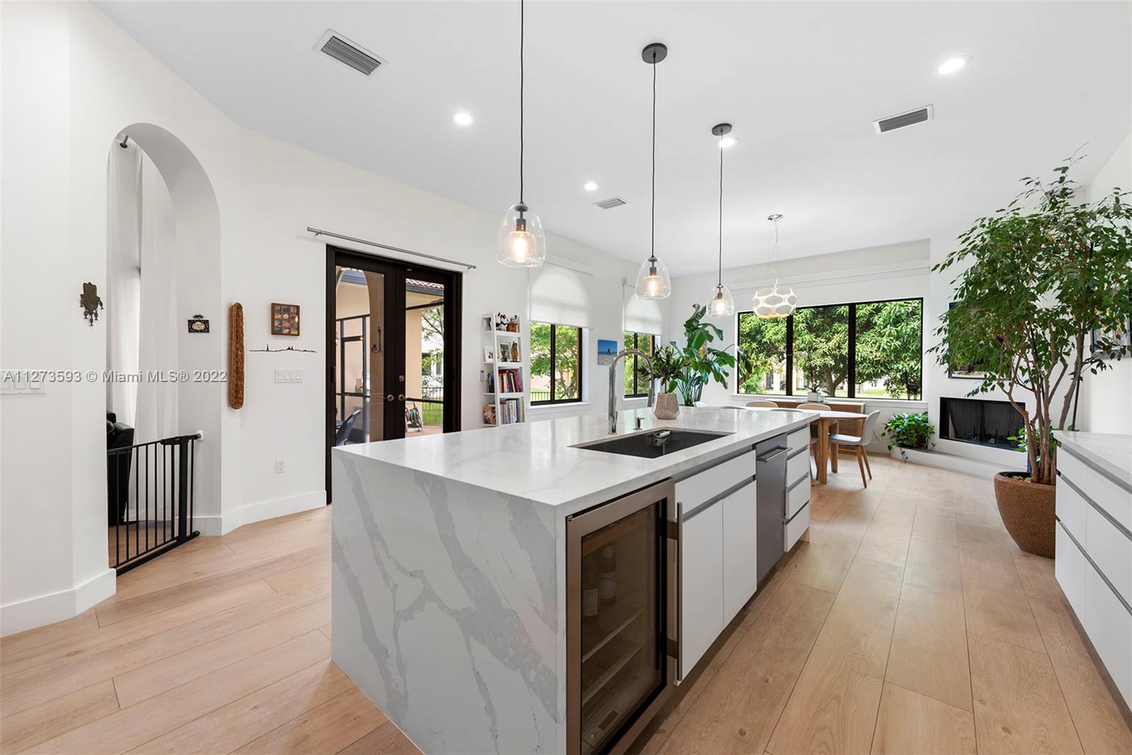 11411 Smathers Circle Pinecrest, FL 33156 - Photo 2 of 44 a kitchen with stainless steel appliances granite countertop a lot of counter space and wooden floors