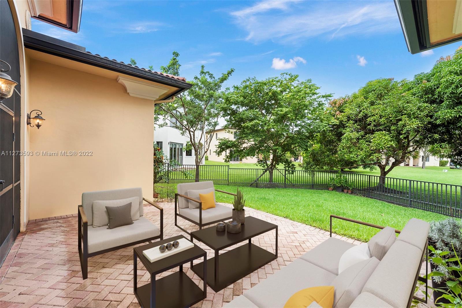 11411 Smathers Circle Pinecrest, FL 33156 - Photo 26 of 44 a view of a patio with couches and a table and chairs with garden view
