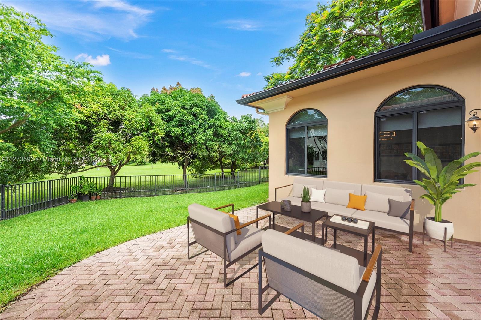11411 Smathers Circle Pinecrest, FL 33156 - Photo 27 of 44 a view of house with backyard and outdoor seating