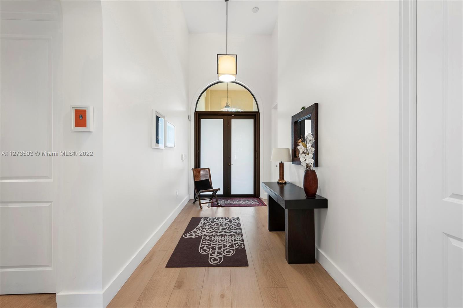 11411 Smathers Circle Pinecrest, FL 33156 - Photo 3 of 44 a view of hallway with wooden floor