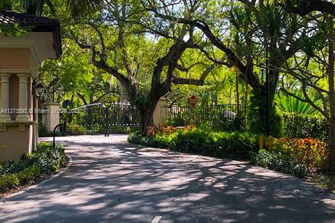 11411 Smathers Circle Pinecrest, FL 33156 - Photo 41 of 44 a wooden bench with view of trees