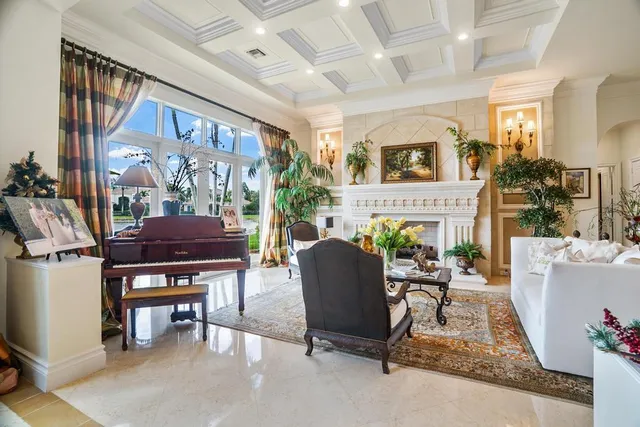a view of a dining room with furniture large windows and wooden floor