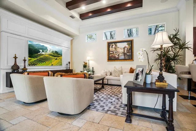 a kitchen with stainless steel appliances kitchen island granite countertop a stove a sink a dining table and chairs with the wooden floor