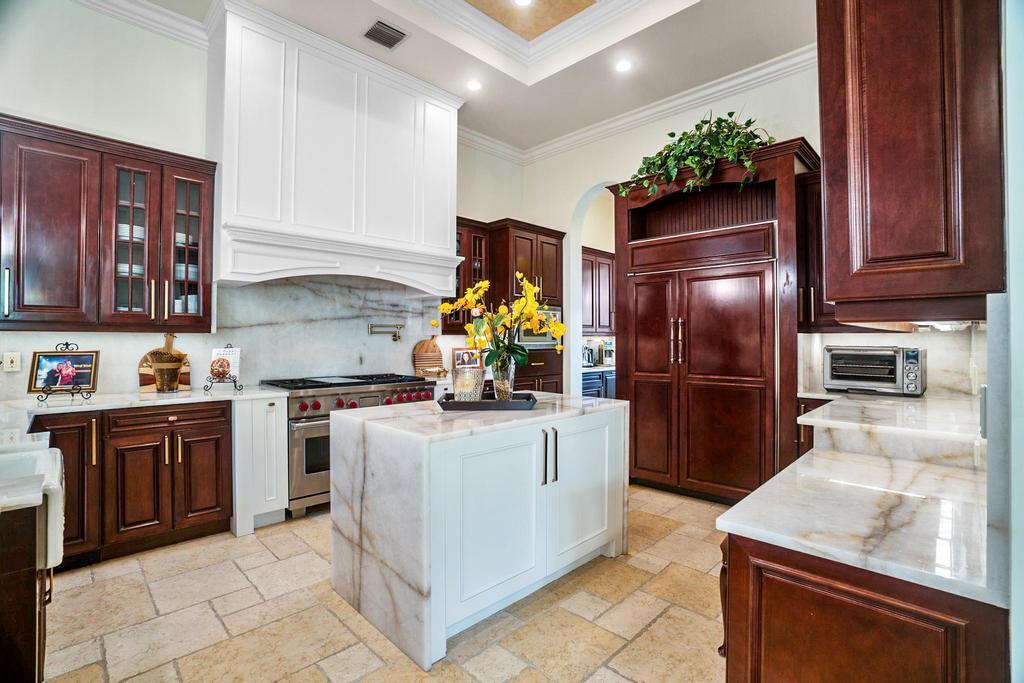 17542 Grand Este Way Boca Raton, FL 33496 - Photo 20 of 45 a kitchen with stainless steel appliances granite countertop a refrigerator stove and sink