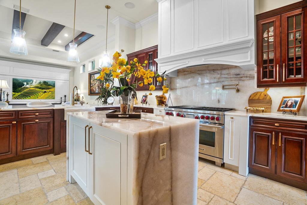 17542 Grand Este Way Boca Raton, FL 33496 - Photo 22 of 45 a kitchen with stainless steel appliances granite countertop a stove and a sink