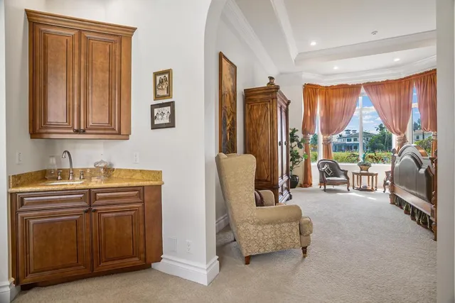 a bed room with a bed and a large window