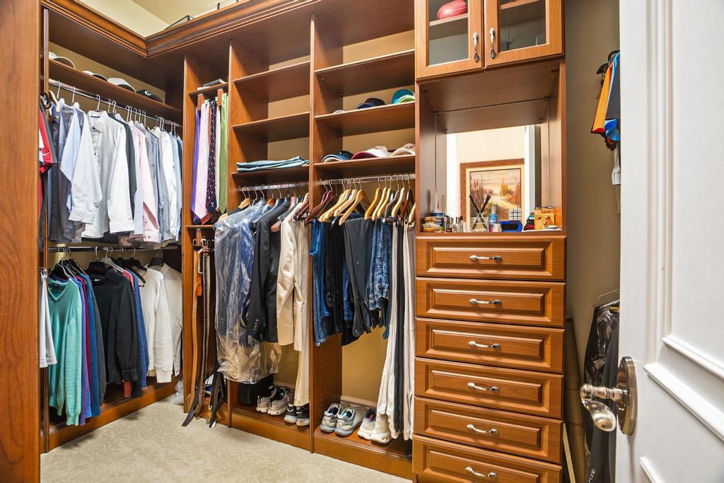 17542 Grand Este Way Boca Raton, FL 33496 - Photo 30 of 45 a view of walk in closet with clothes and shoes
