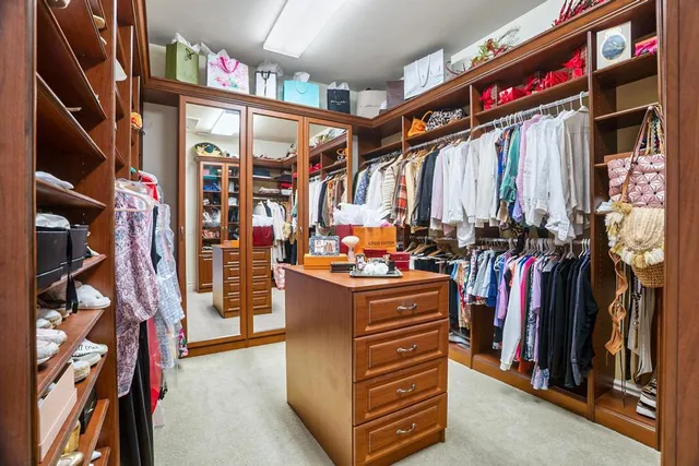a bathroom with a sink a mirror and a shower