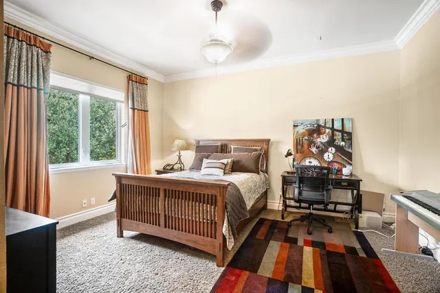 a living room with furniture a chandelier and a window