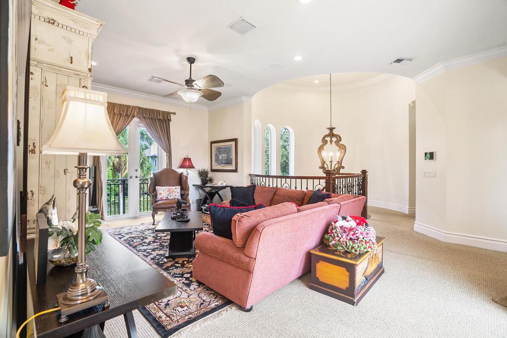 17542 Grand Este Way Boca Raton, FL 33496 - Photo 34 of 45 a living room with furniture a chandelier and a window