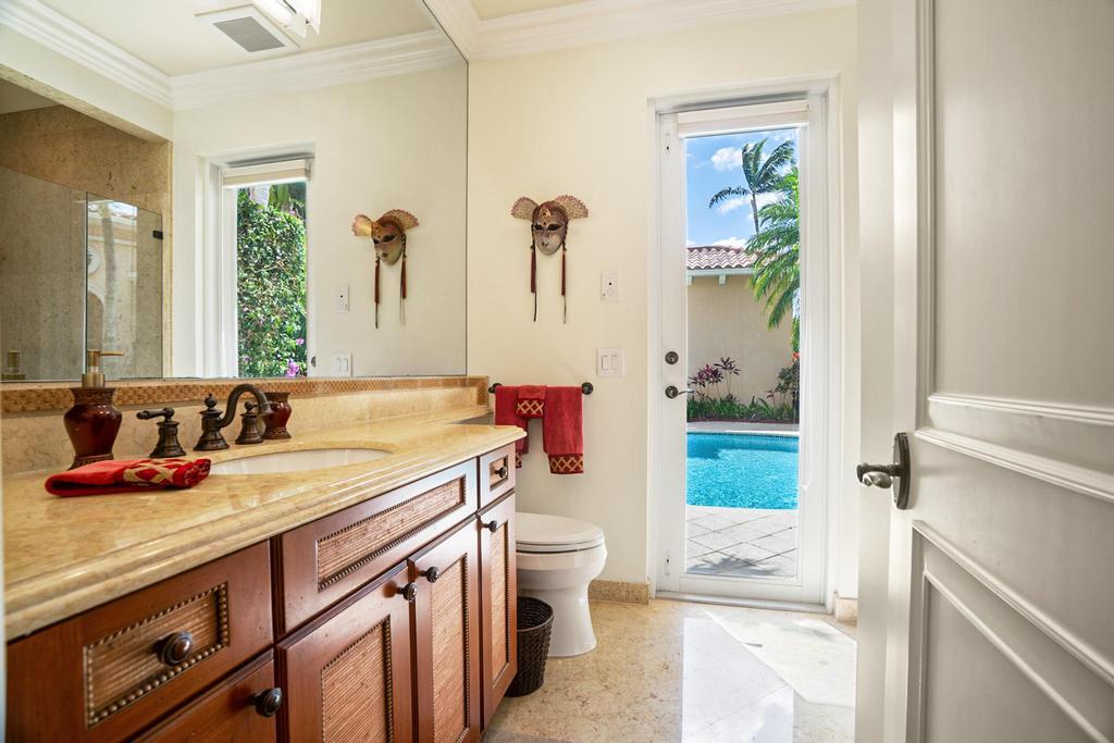 17542 Grand Este Way Boca Raton, FL 33496 - Photo 43 of 45 a bathroom with a granite countertop sink a toilet a shower and a mirror