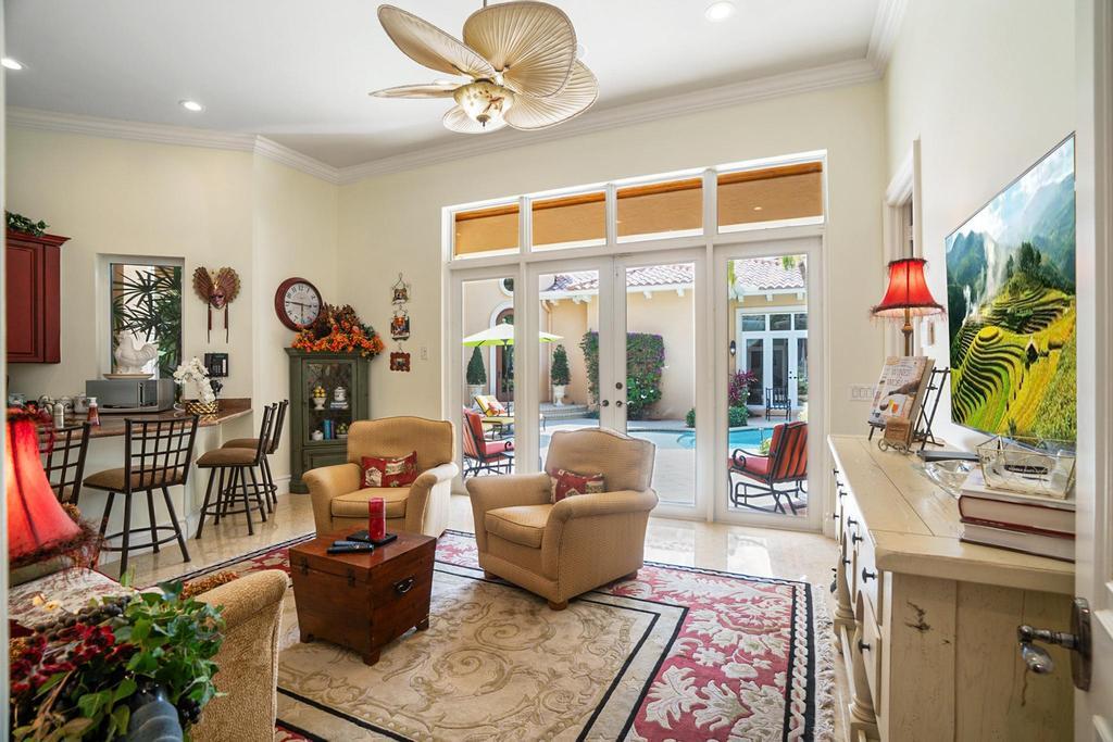 17542 Grand Este Way Boca Raton, FL 33496 - Photo 45 of 45 a living room with furniture a rug and a flat screen tv