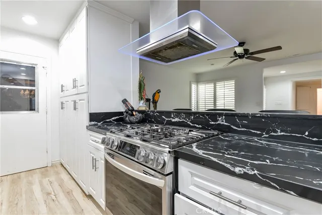 a kitchen with a stove and a microwave