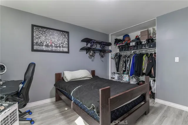 a bedroom with a bed and a desk