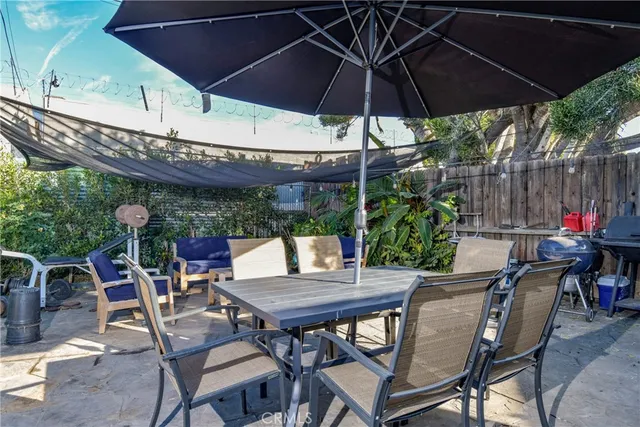 a patio with a patio table and chairs