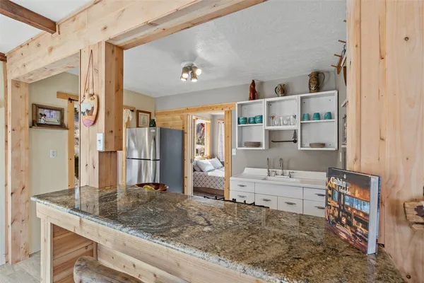 a large bathroom with a granite countertop sink mirror and shower