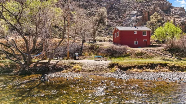 a view of a house with a snow in the yard