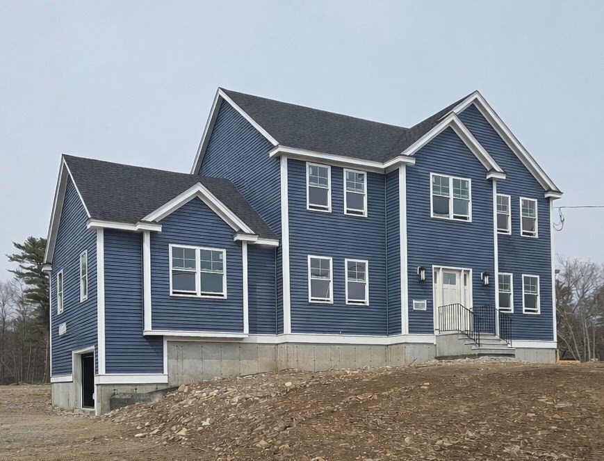 290 Salem Road Dracut, MA 01826 - Photo 2 of 16 a front view of a house with a yard