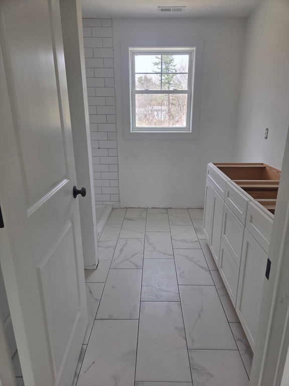 290 Salem Road Dracut, MA 01826 - Photo 8 of 16 a view of an empty room with a window