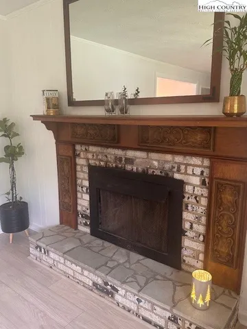 a fireplace with a vase on top of it