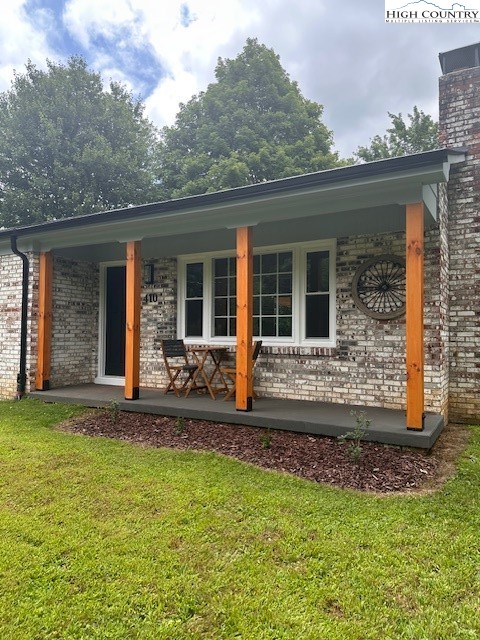 410 Cook Street Jefferson, NC 28640 - Photo 19 of 22 a front view of a house with yard