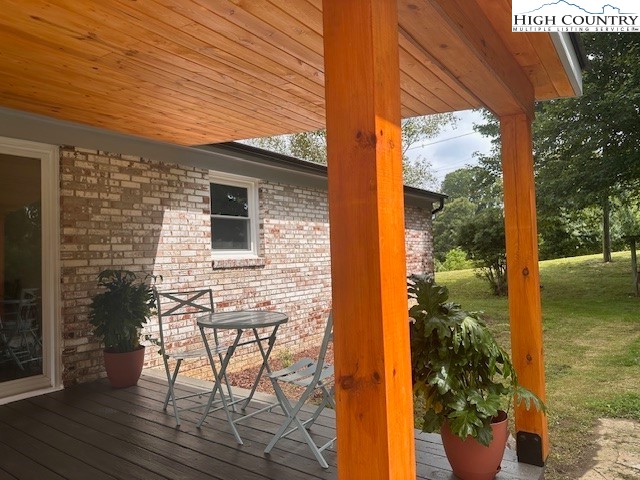 410 Cook Street Jefferson, NC 28640 - Photo 20 of 22 a view of a porch with chairs and potted plants