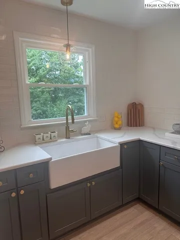 a kitchen with a sink and a window