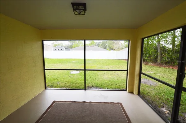 a view of an empty room with a window
