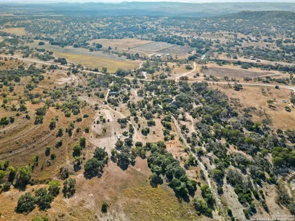 an aerial view of house with yard