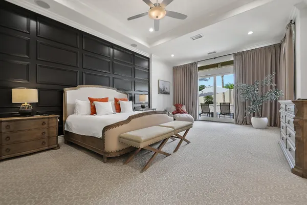 a bedroom with a bed and cabinets