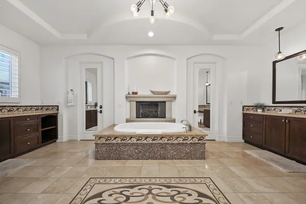 a bathroom with a shower sink and mirror