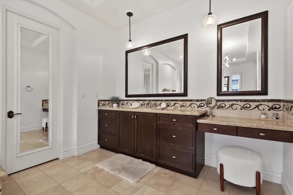 a spacious bedroom with bed and a large window