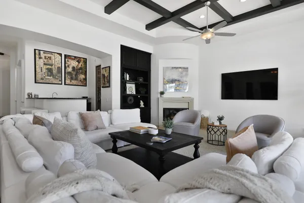 a kitchen with a table chairs stove and microwave