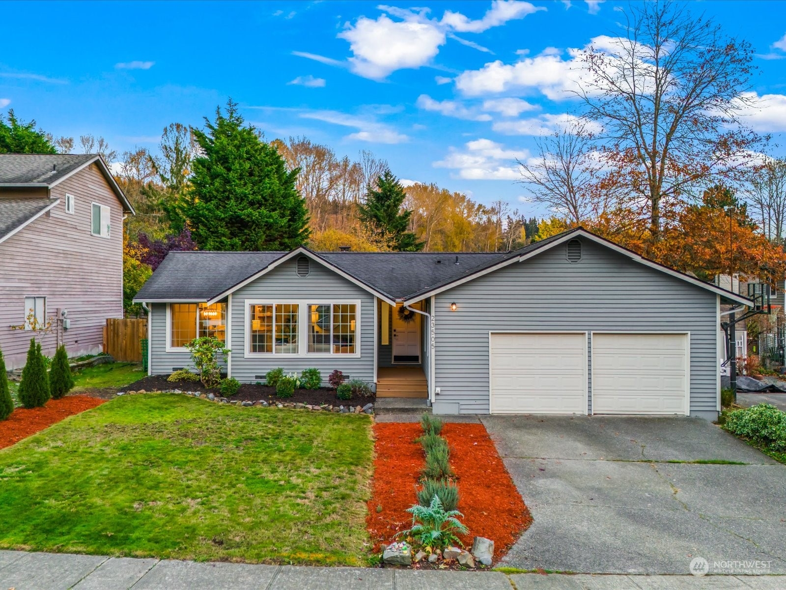 23505 13th Place West Bothell, WA 98021 - Photo 1 of 1 a front view of a house with a yard and garage