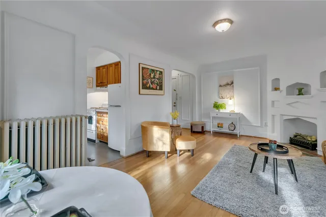 a living room with furniture and a fireplace