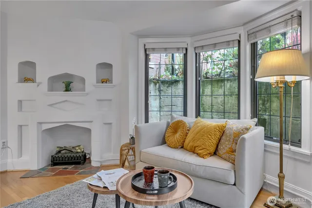 a living room with furniture and a fireplace